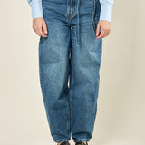 Jeans donna modello balloon. Vestibilità mom fit con laccetto tono su tono. F32129 JEANS BASEVENTI