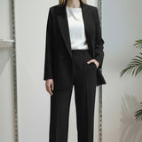 Pantalone da donna modello largo in tessuto crêpe con vita alta e mezzo elastico. DR5038/PANT NERO REver 