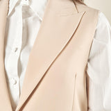 Gilet donna lungo in tessuto tecnico. Chiusura a un bottone, revers a lancia e tasche con pattine. GL003035 ONICE ARTIGLI 