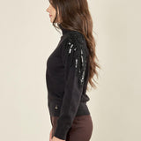 Maglia donna manica lunga con collo alto e applicazioni strass. Eleganza brillante e comfort quotidiano. MA002800 NERO ARTIGLI 