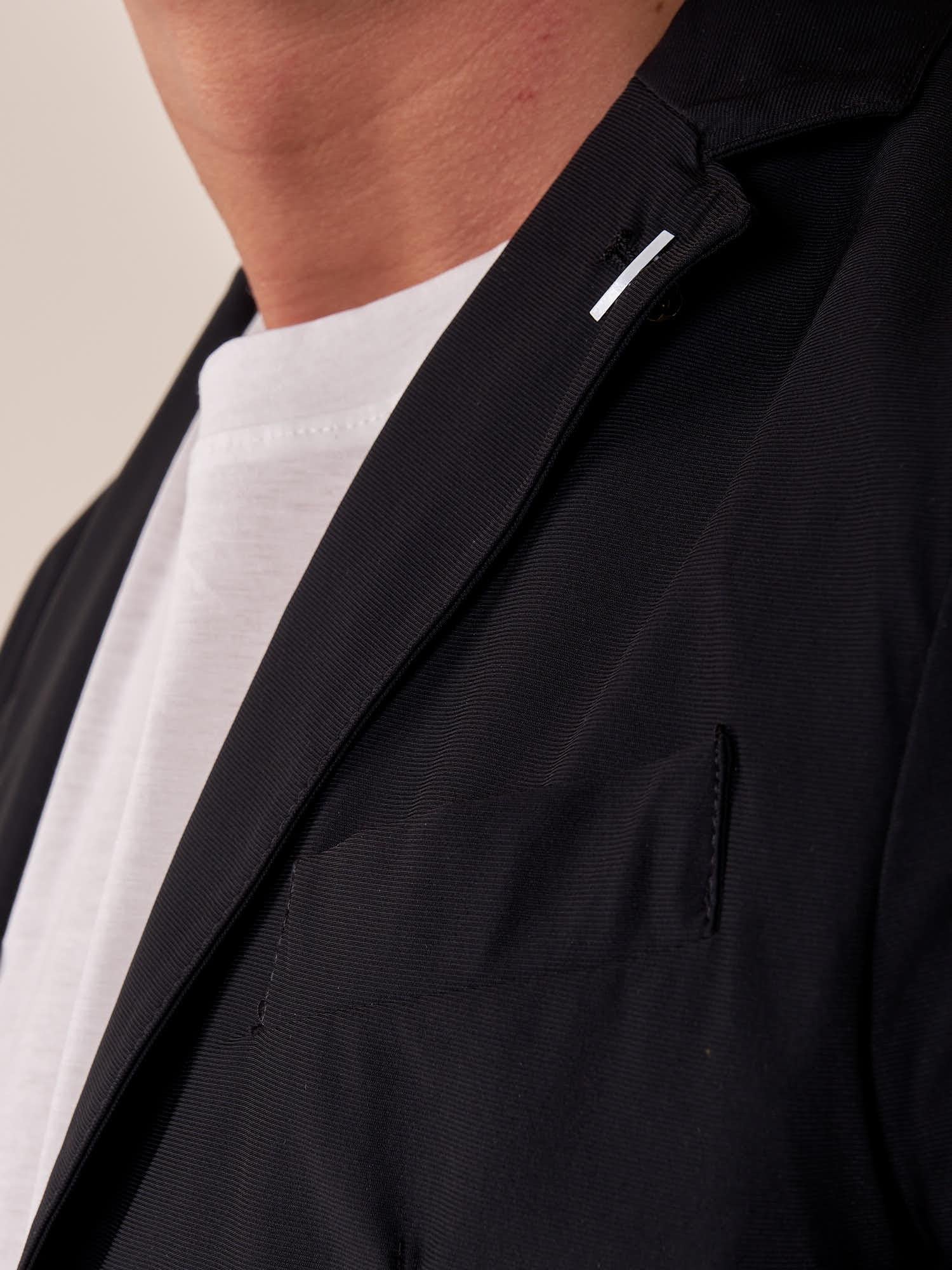 Giacca uomo tessuto tecnico stretch due bottoni tasca a toppe. OC1S2S5G01 NERO OVER-D 