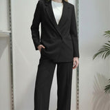 Giacca da donna in tessuto crêpe a doppio petto con due bottoni e tasche a filetto. DR5038 NERO REver 