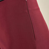Pantalone donna in tessuto tecnico. Lunghezza alla caviglia con spacchetto laterale e zip invisibile. PA003491 BORDEAUX ARTIGLI 