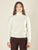 Maglia donna manica lunga con collo alto e applicazioni strass.  Eleganza brillante e comfort quotidiano.